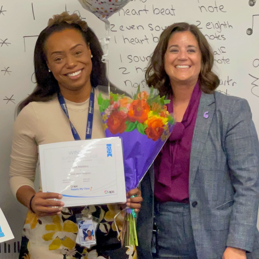 Teacher receiving award in her classroom